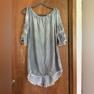 Gray dress with floral pattern on sleeves and shoulder cutouts.